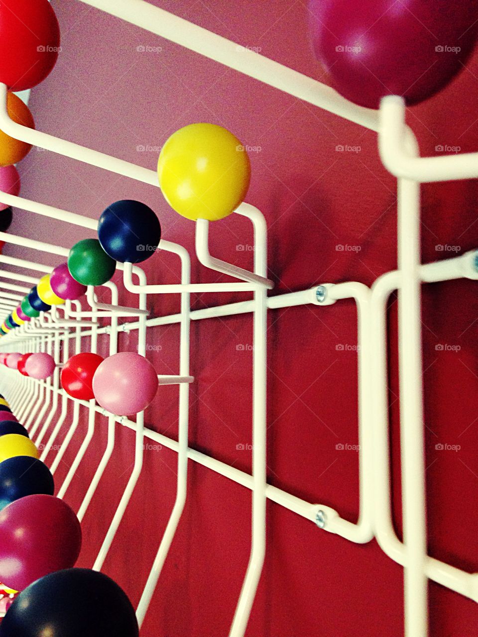 Yellow wooden ball . Colorful coat rack 