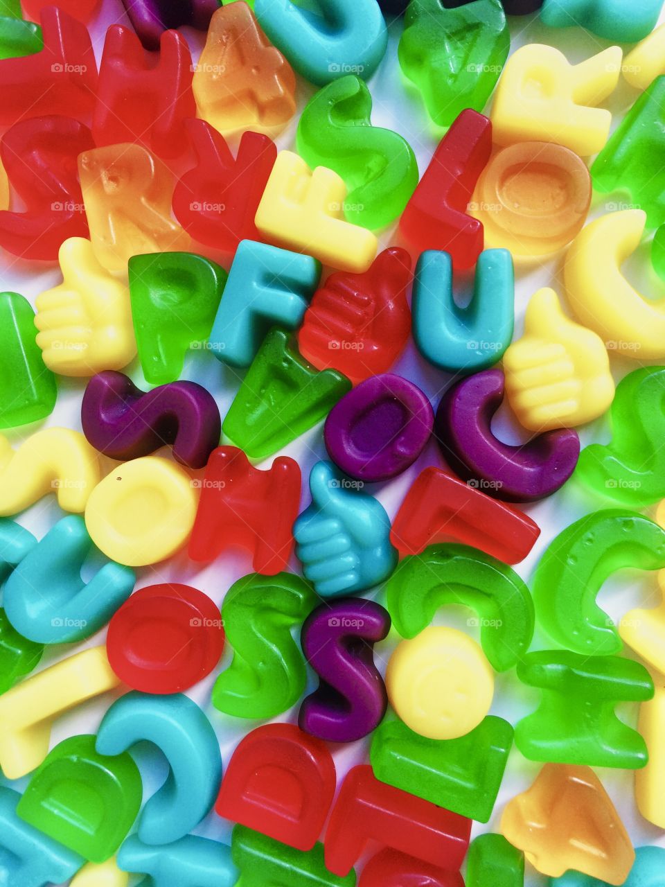 multicolored jelly candies in the form of letters and numbers