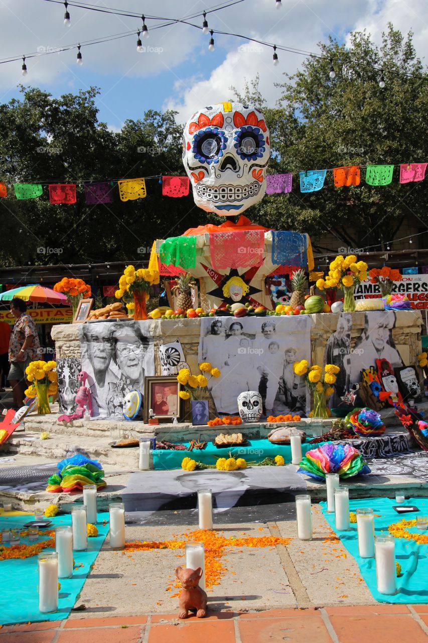 The central decoration of the Día de los Muertos celebration in San Antonio, Texas is a skull atop a fountain. The lights and colors are as festive as they are an appropriate memorial for souls of days past. 