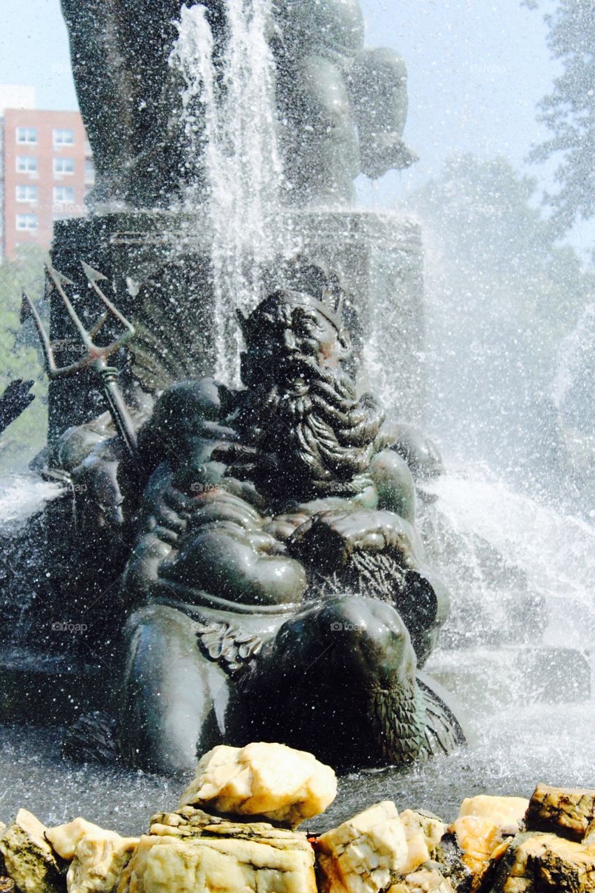 Poseidon at leisure, Brooklyn.. Statue of Poseidon getting a shower in Prospect Park, Brooklyn, NYC. Tried to accentuate the droplets.