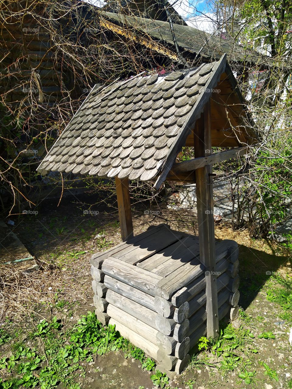 Wooden well with water in the courtyard of the Izmailovsky vernissage