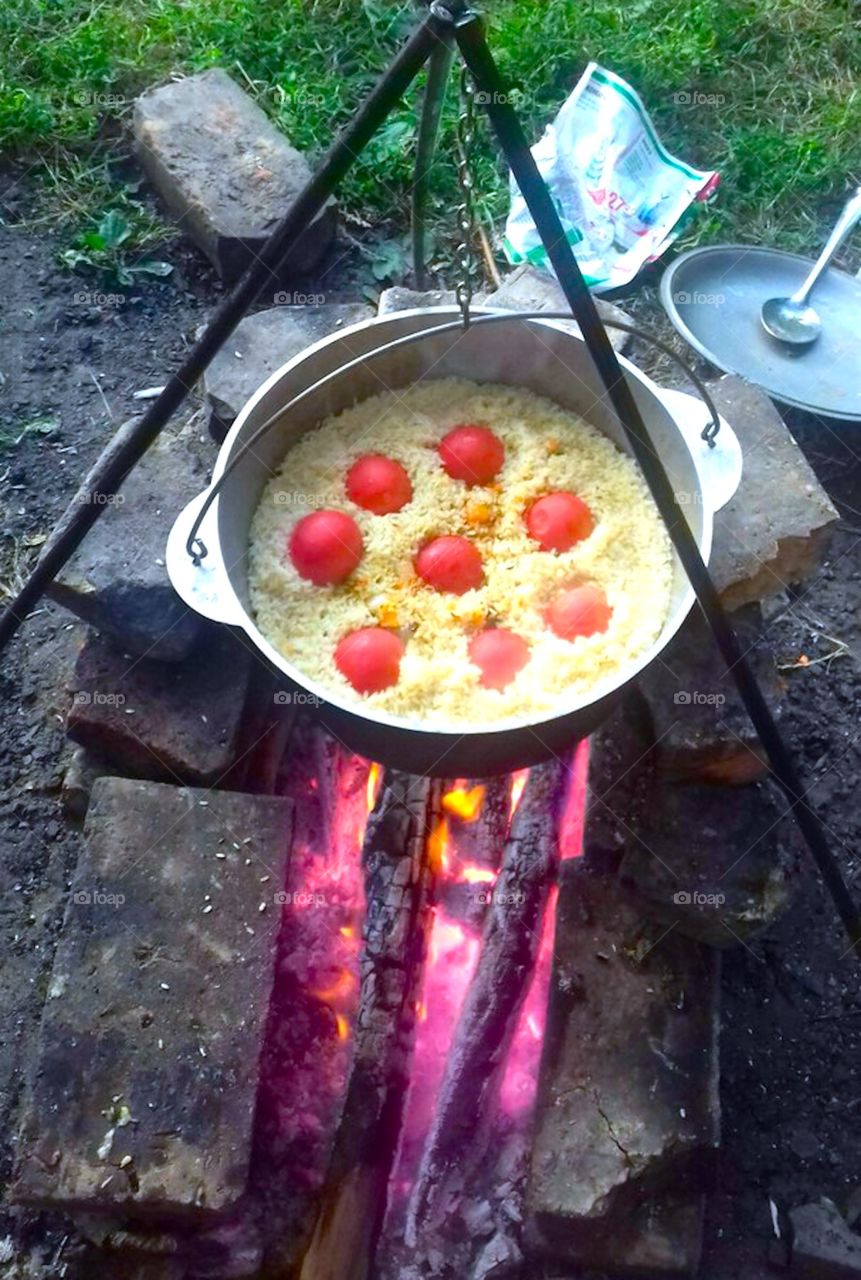 rice and tomato cooked on fire 