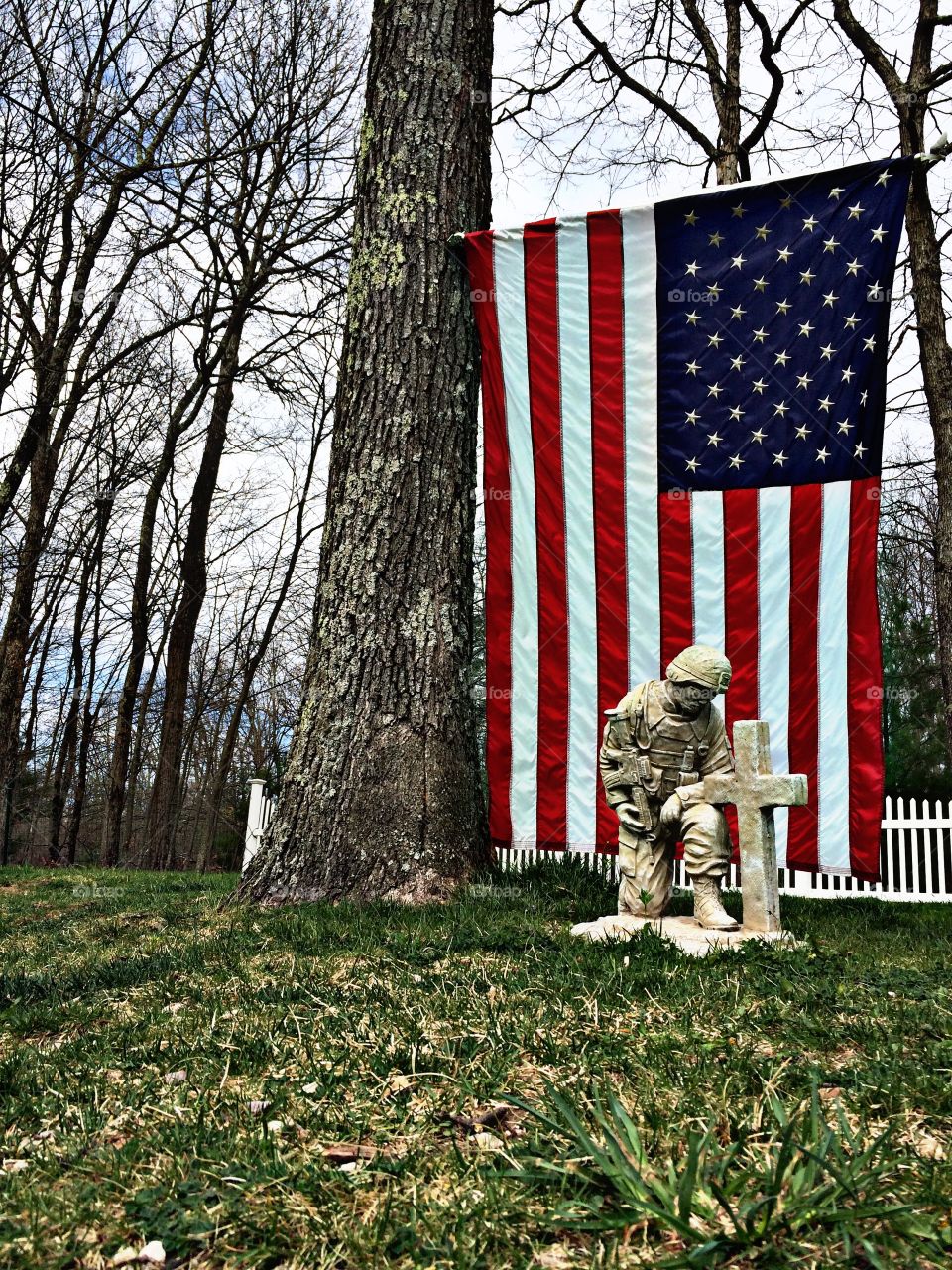 Flag with Soldier Memorial Statue in front; Personal