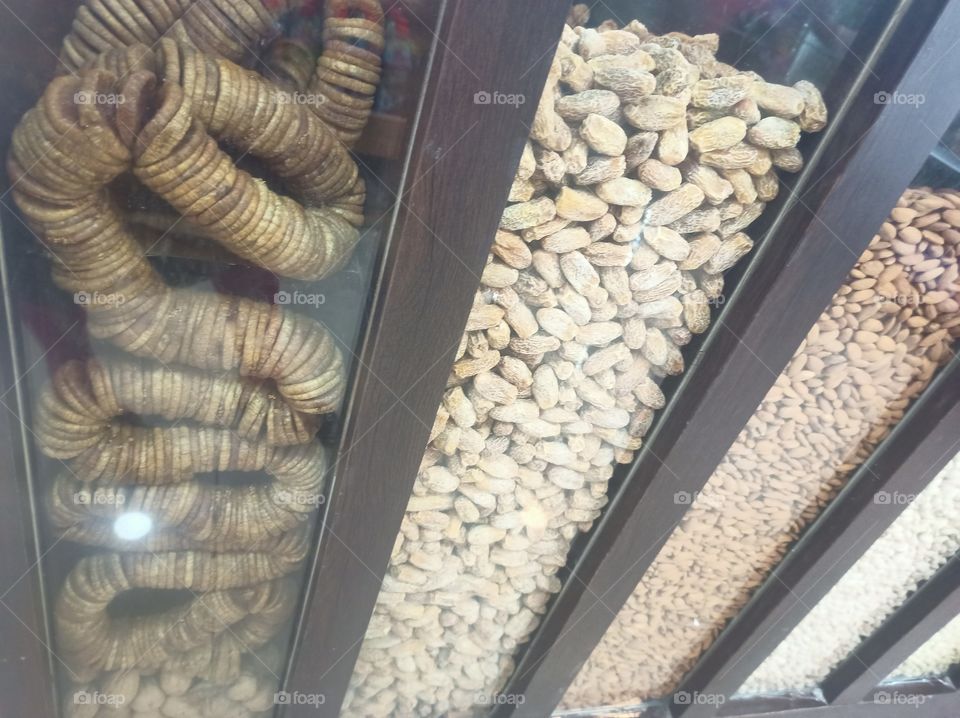 Showcasing of Dry fruits in the glass boxes at the shopping mall