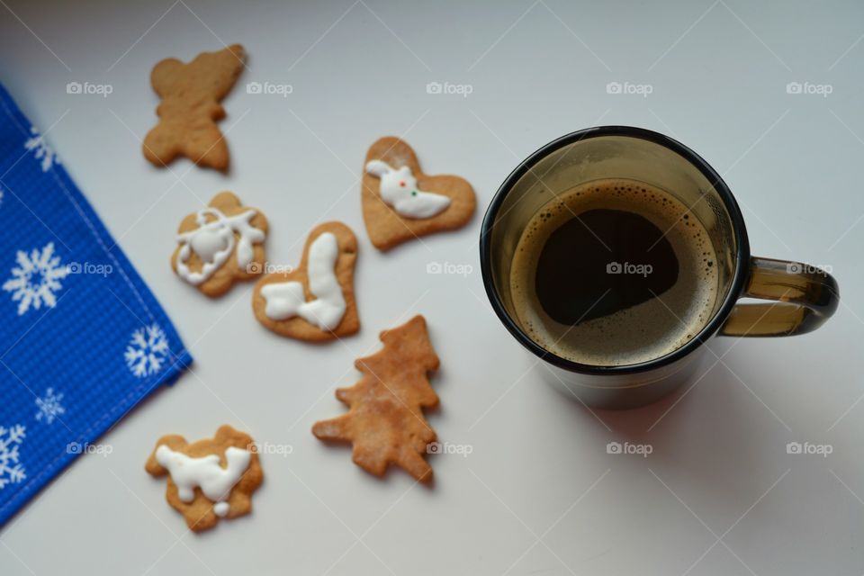 High angle view of coffee cup with cookie