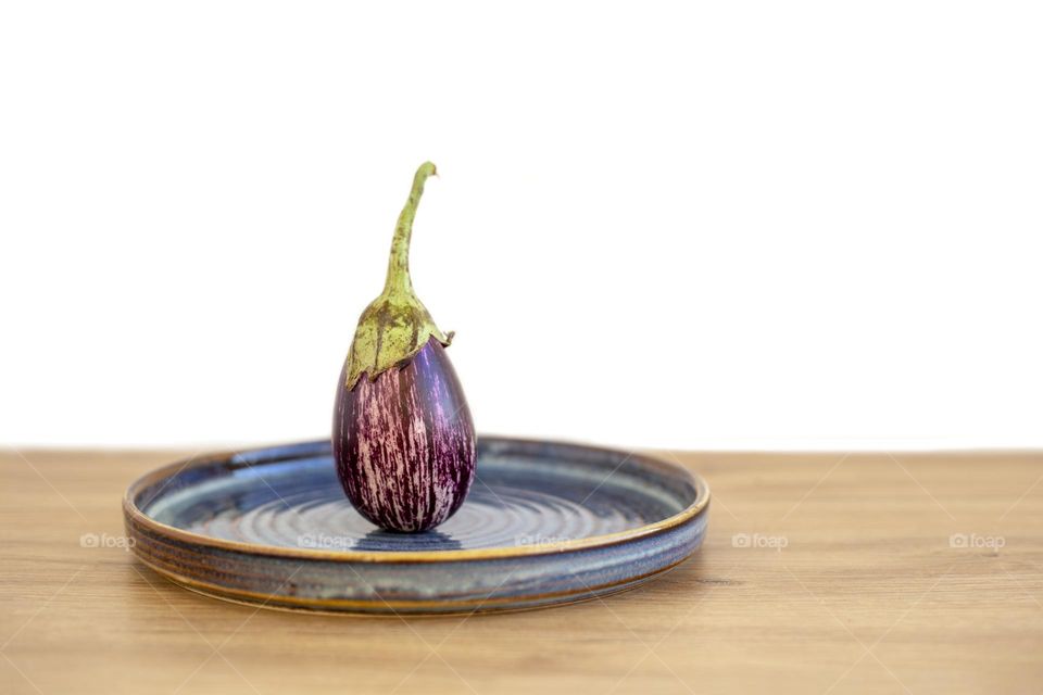 Mini aubergine in the blue plate 
