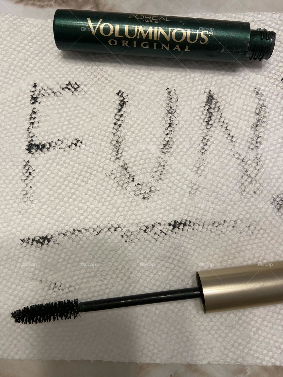 L’Oréal Voluminous Mascara in Deep Green with a word that describes why I like it. 