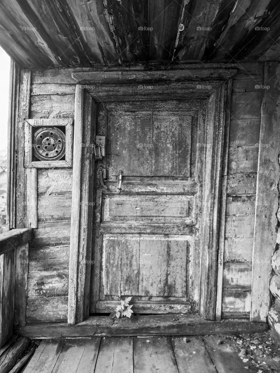 Old Door on the porch of a wooden house