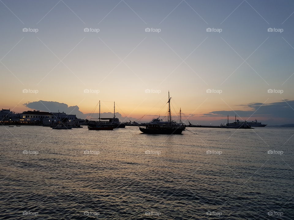 Greece beautiful sunset boats clouds sky