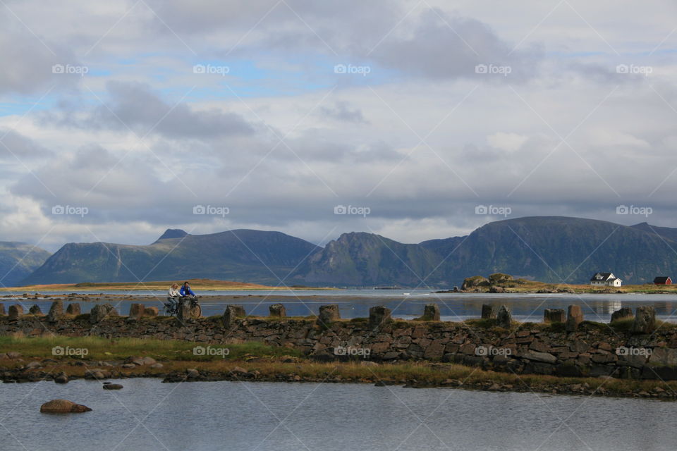 People cycling on bridge