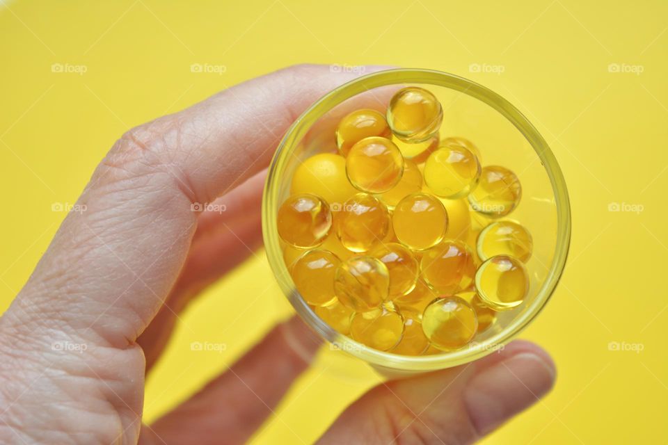 vitamins capsules oils round beautiful texture in the hand