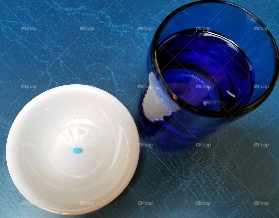 Controlled substance and glass of water.  Medication time.