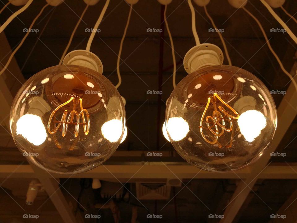 old vintage round light bulbs hanging with the ceiling