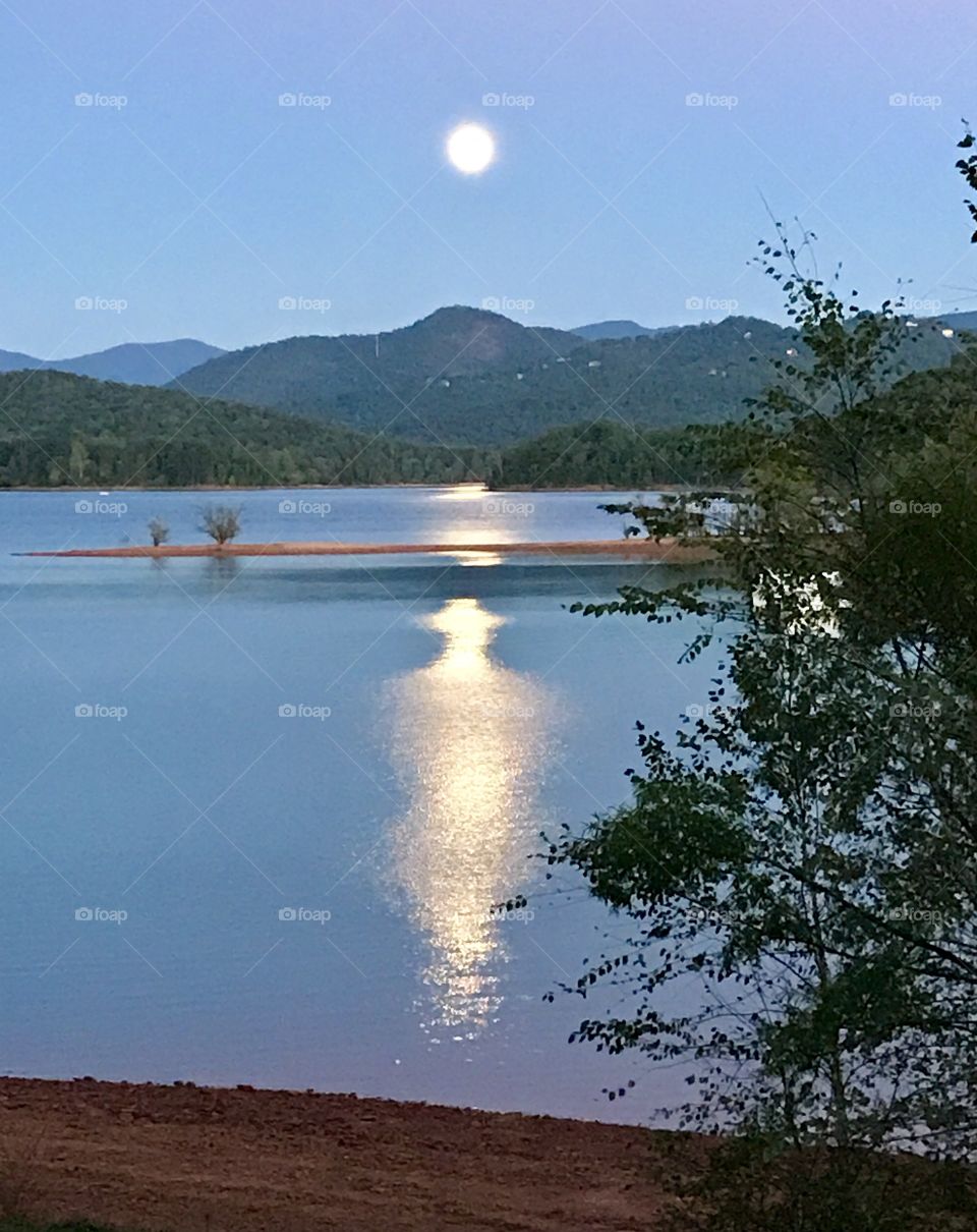 Calming moon and its reflection 