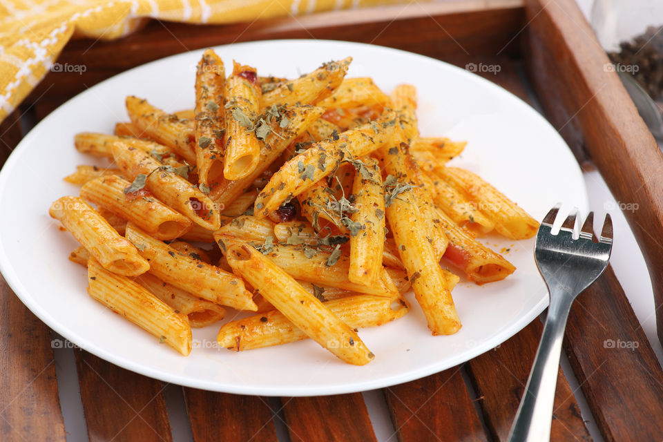 Delicious Penne Pasta food serve in a tray