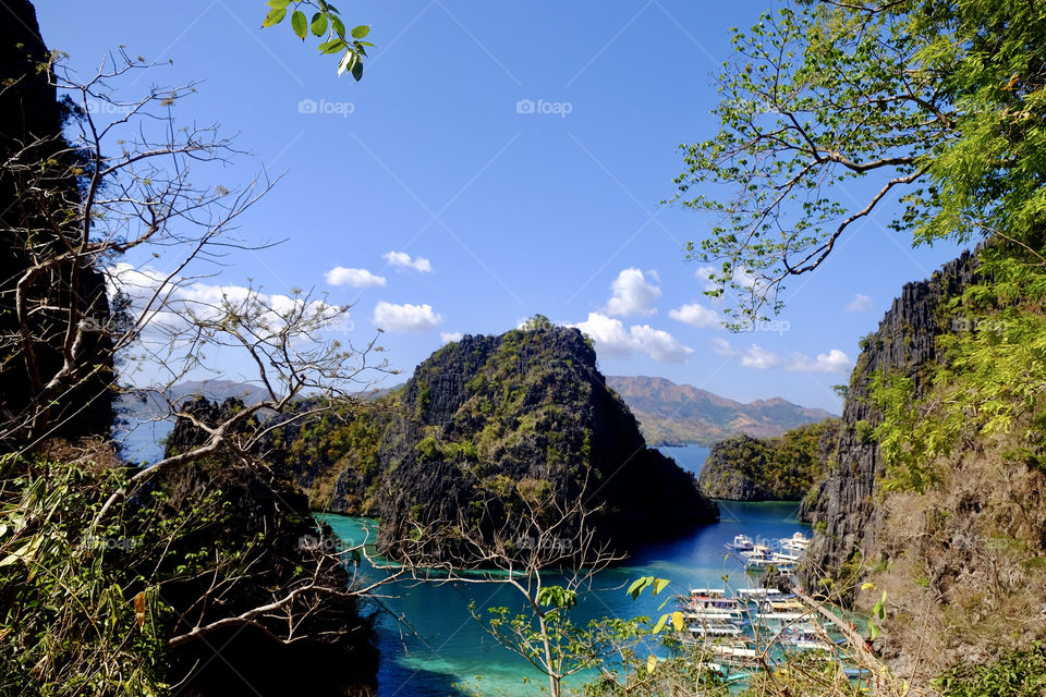 The best view of nature in one photo from the hill top. No filter needed for this majestic nature. The ocean the mountain, trees, sky and the breeze. So perfect together