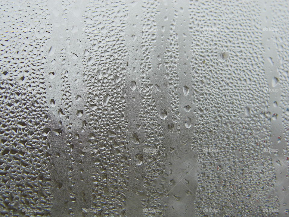 Water drops on window glass after rain