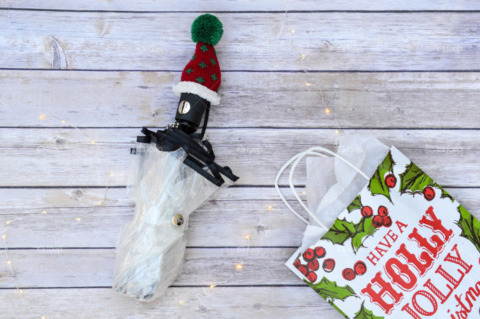 Umbrella with winter hat and Christmas gift bag