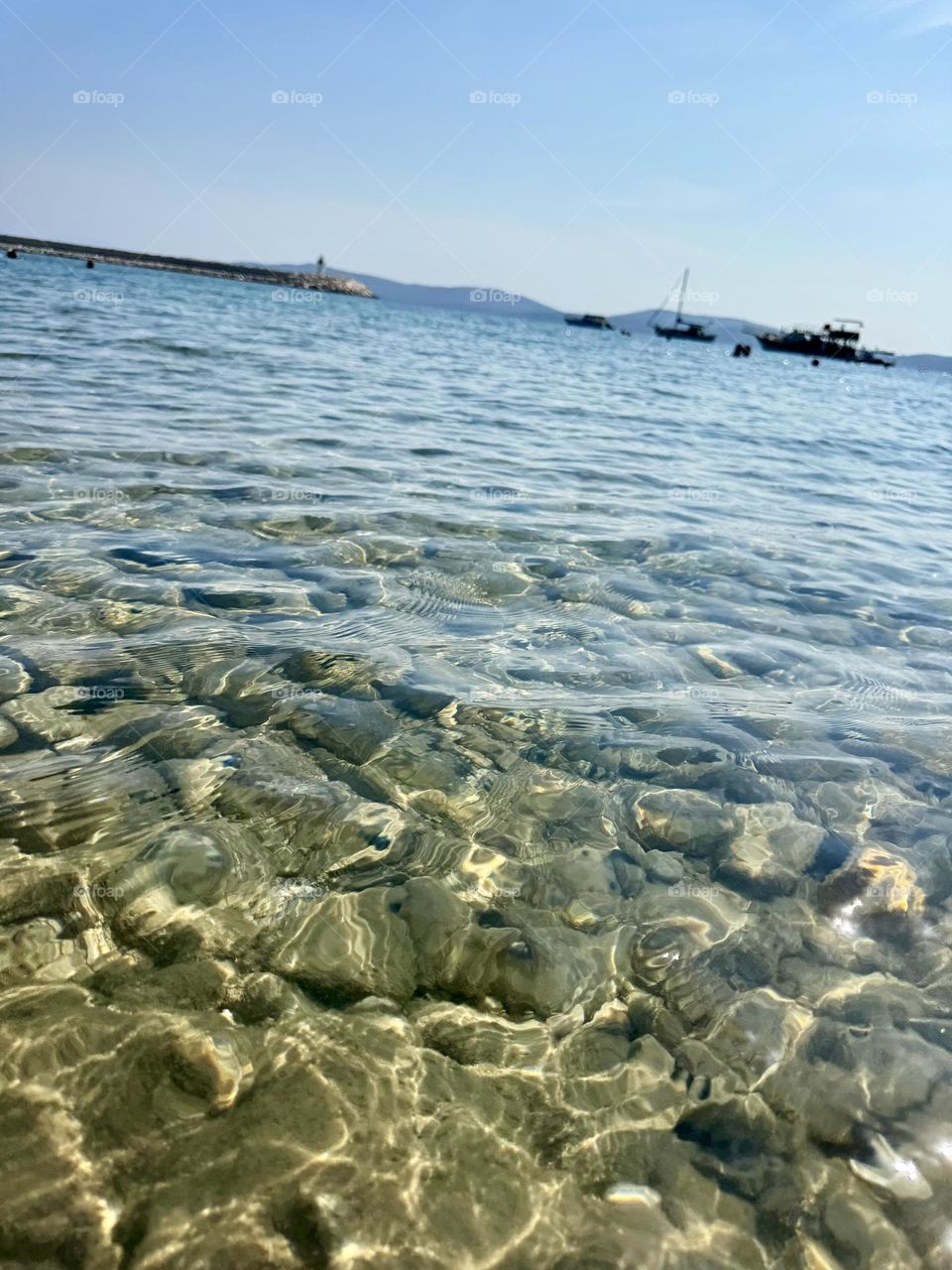 Seabed. Cobblestones. Clear water.
