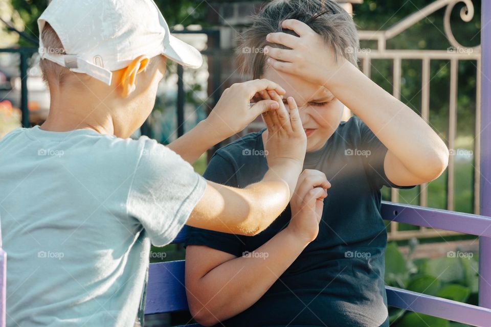 Two kids friends playing feeling disgusting 