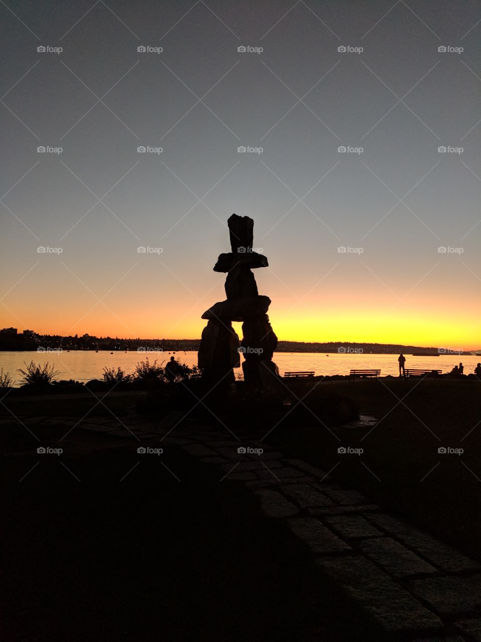 English Bay Inukshuk and sunset in a fall afternoon
