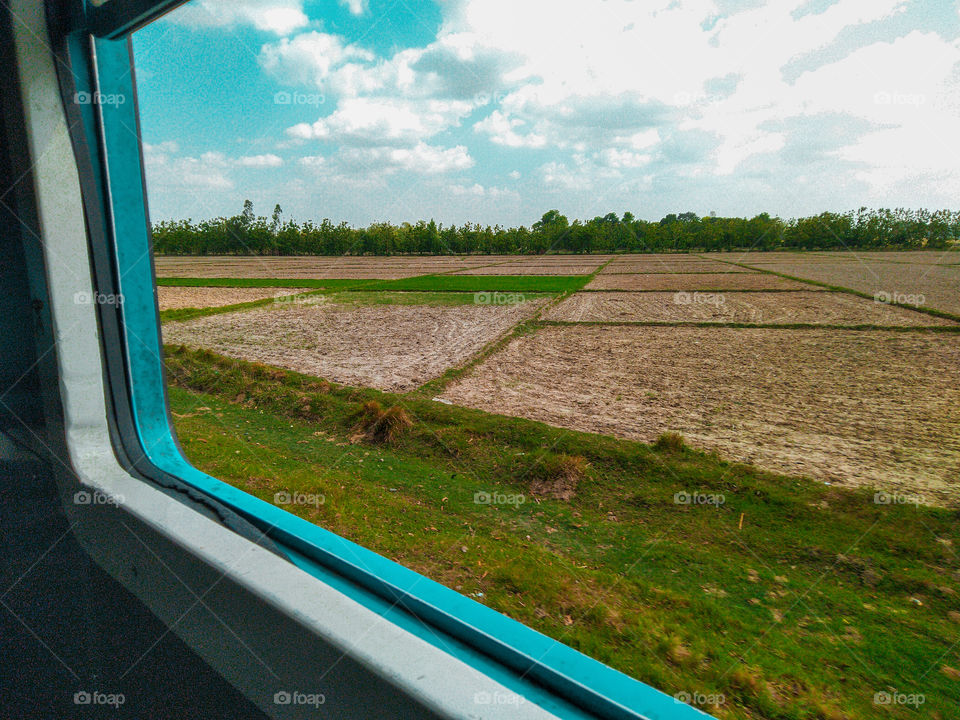 train window seat blue sky agriculture Field farming forest trees