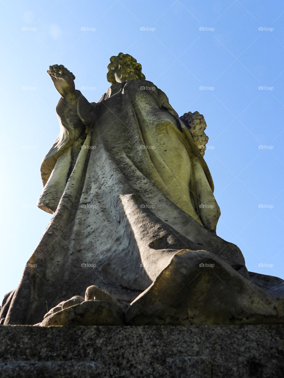 shot of cemetery statue from low angle