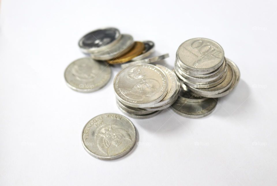 Coins are part of the medium of exchange in economics and business
