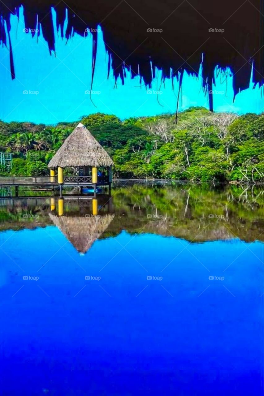 cabin on the blue lake reflecting the natural landscape