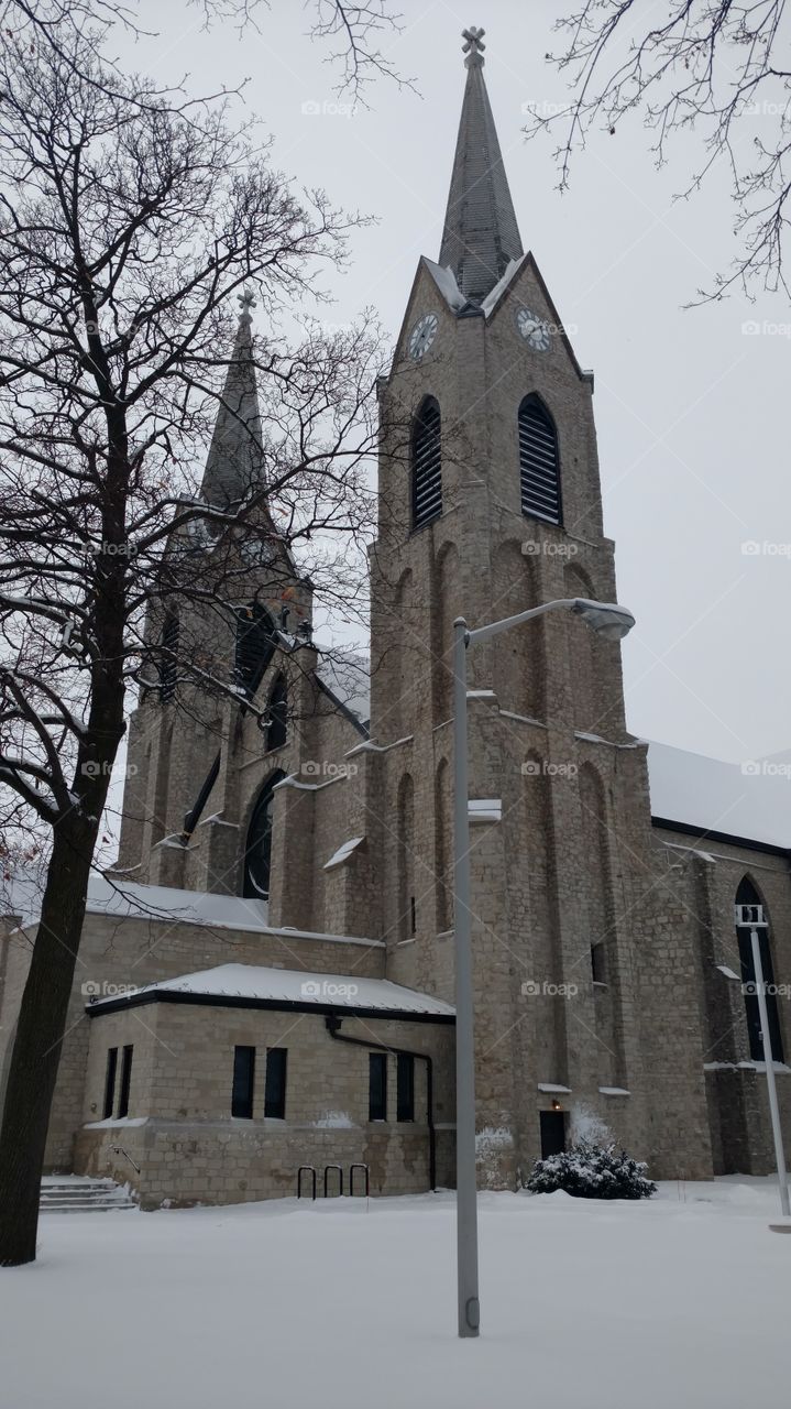 Tall church in snow