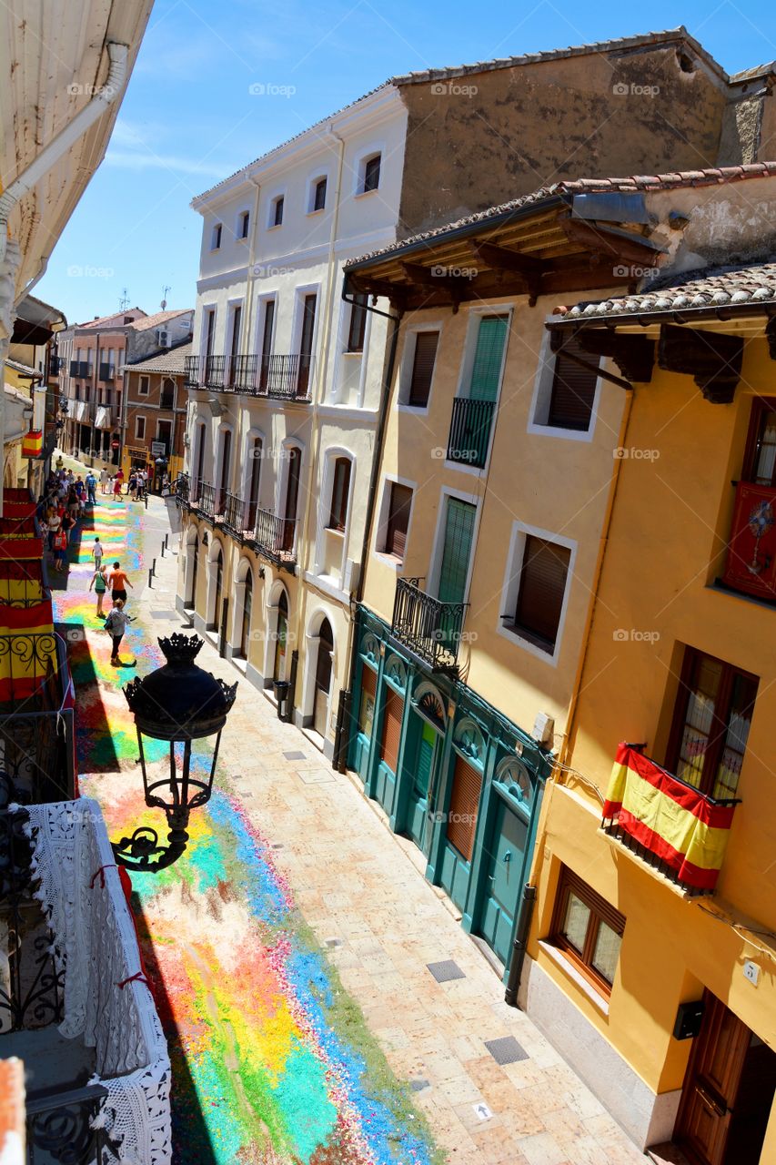 one street coloured in a village during the summer