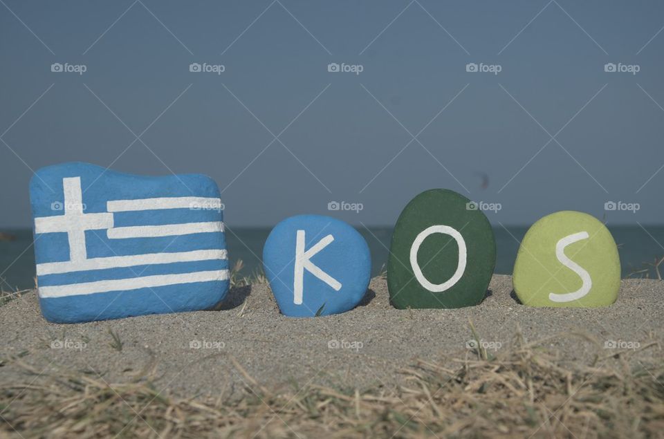 Souvenir of the greek isle Kos on colourful stones