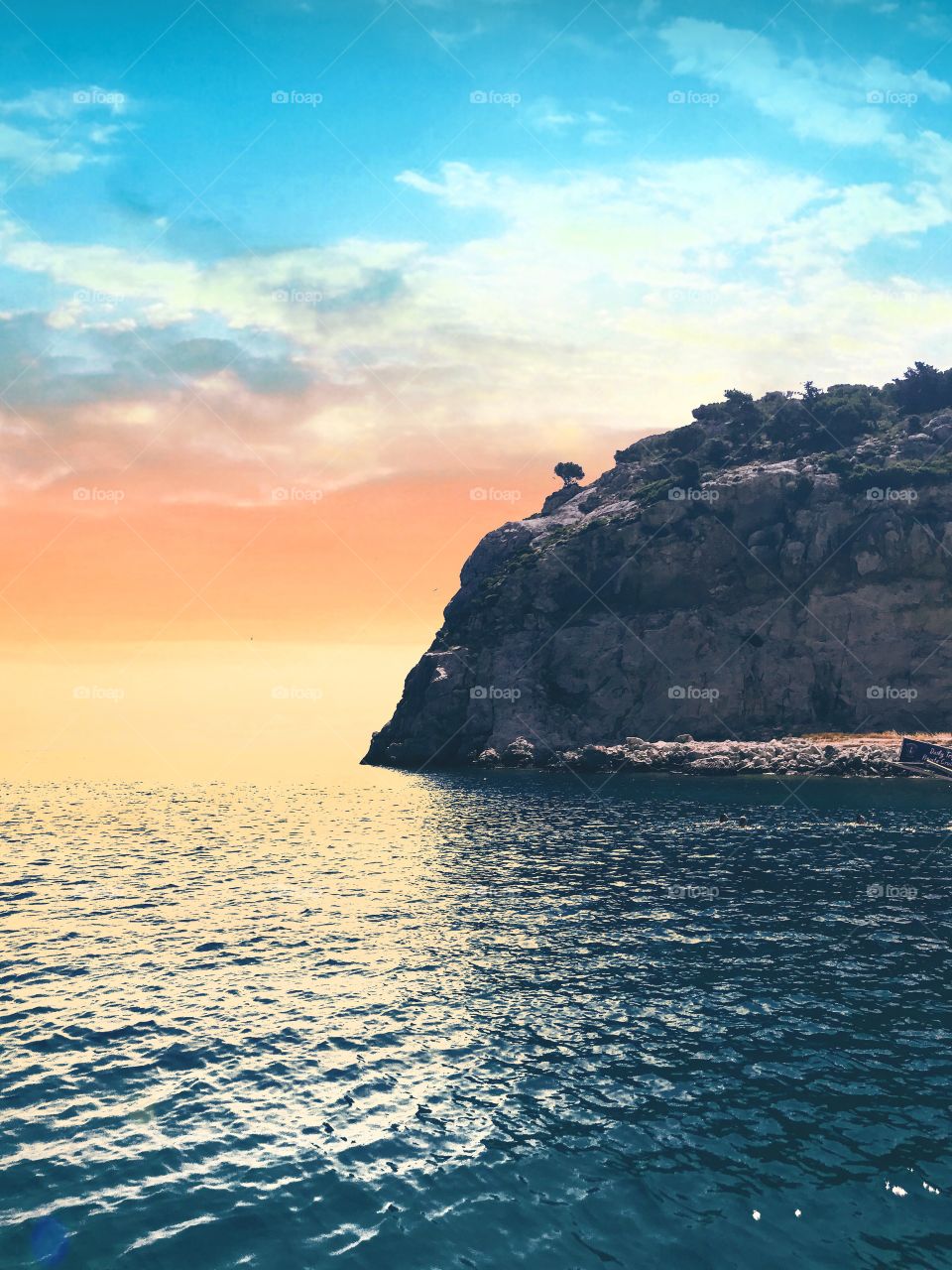 Beautiful sunset in the nature. orange sunset. colors are reflected on the water's surface . mountain landscape. water view. 