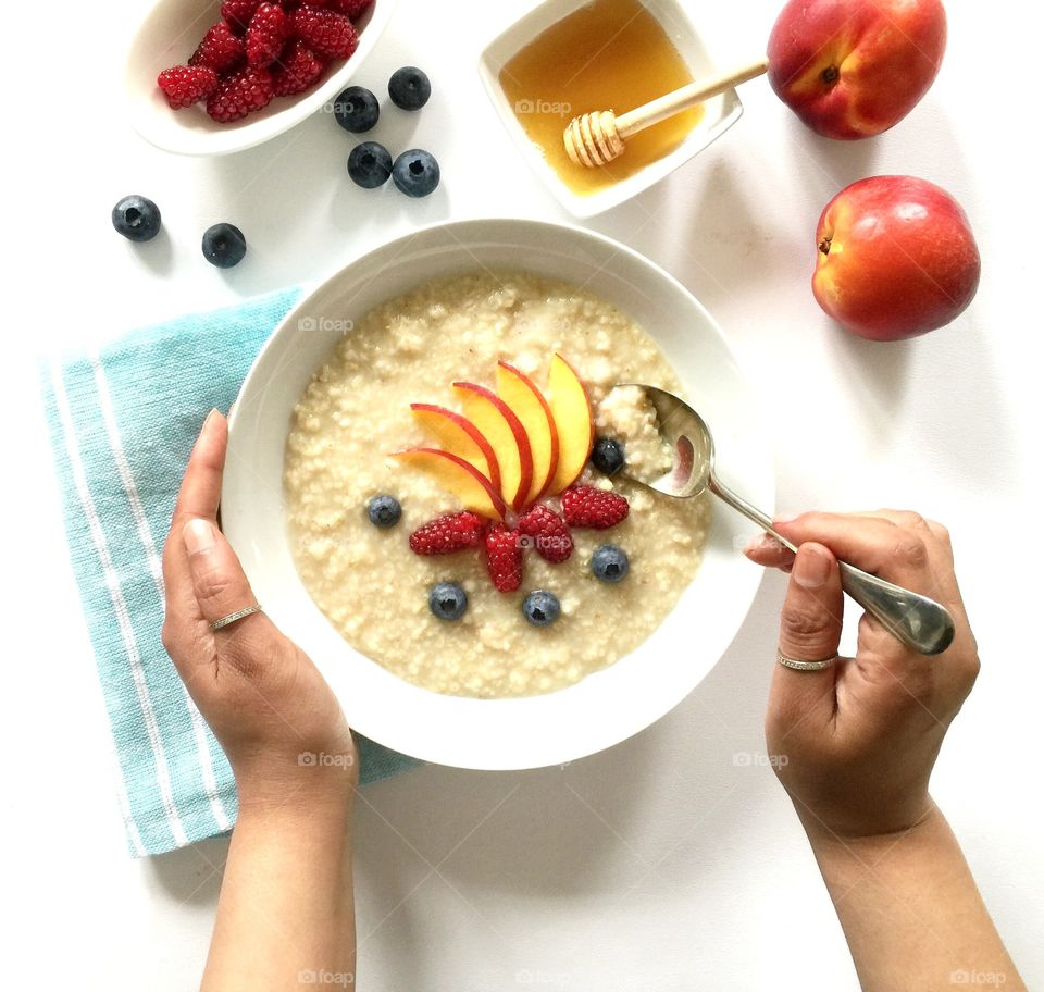 My healthy porridge oats breakfast with fresh fruits 