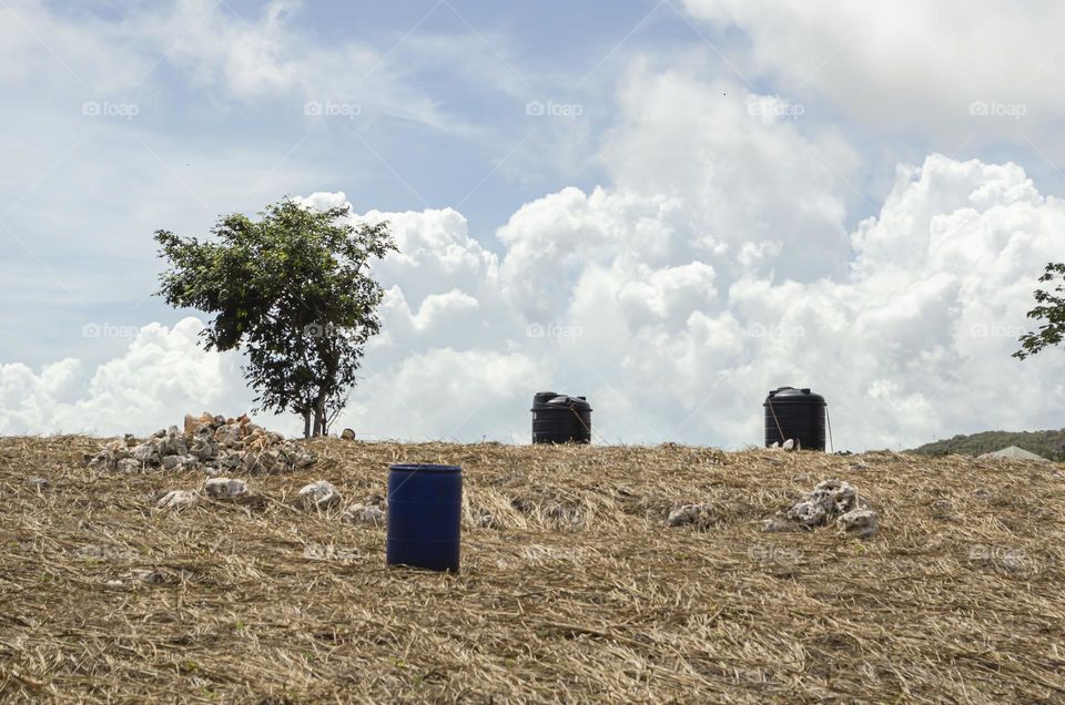 Water Drums On Farmland