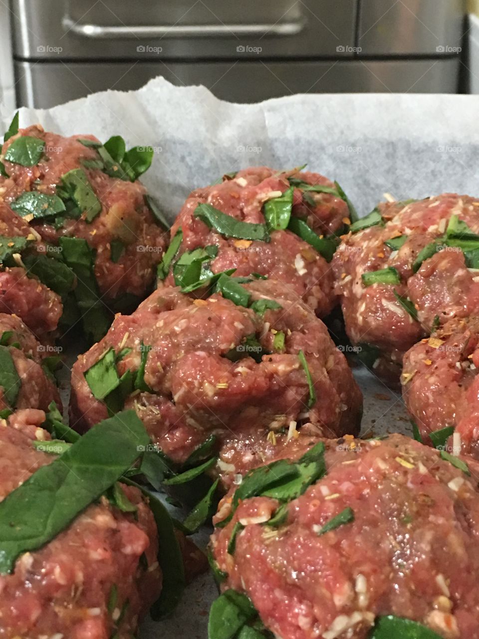 Minced ground beef meatballs prepared and ready to be cooked closeup view food preparation what's cooking