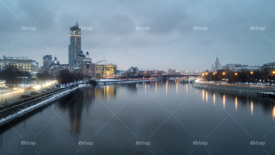 HoPanoramic view of Moscow river with Moscow International House of Music in the background