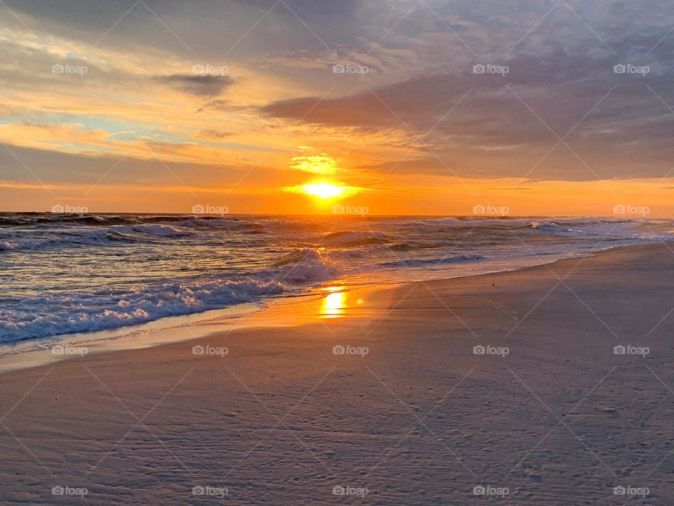 Gulf Sunset - The Sun reflects off seas and oceans because the water acts as a smooth surface on a macroscopic scale. A rippled – but locally smooth – surface will reflect the sun at different angles, creating different observable images of the sun.