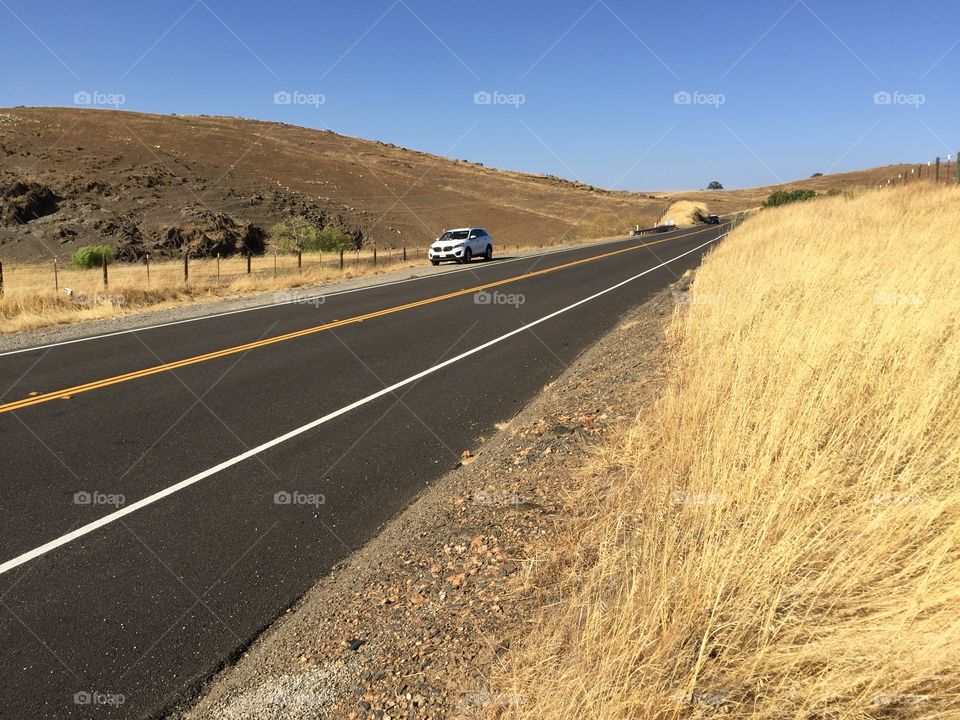 Street between Golden hills of the California