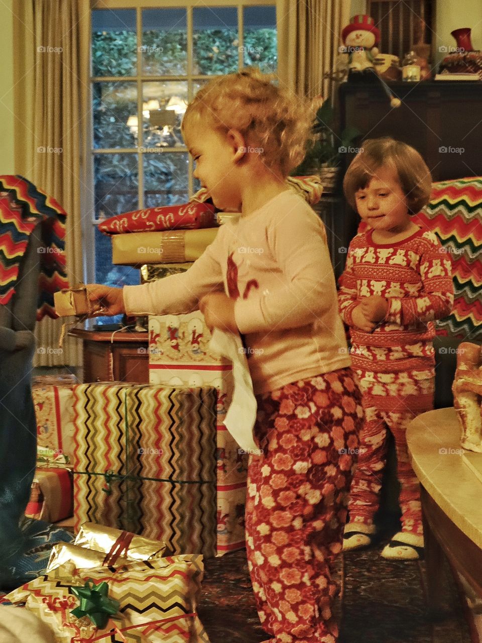 Two girls with christmas gifts