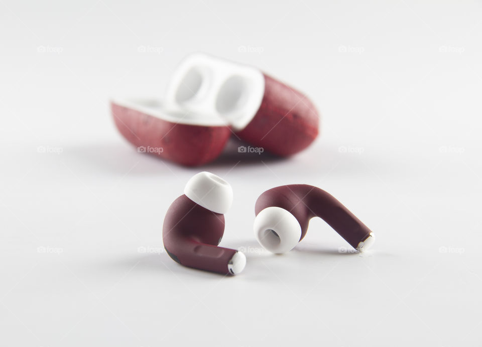 Red colour airpods with white background 
