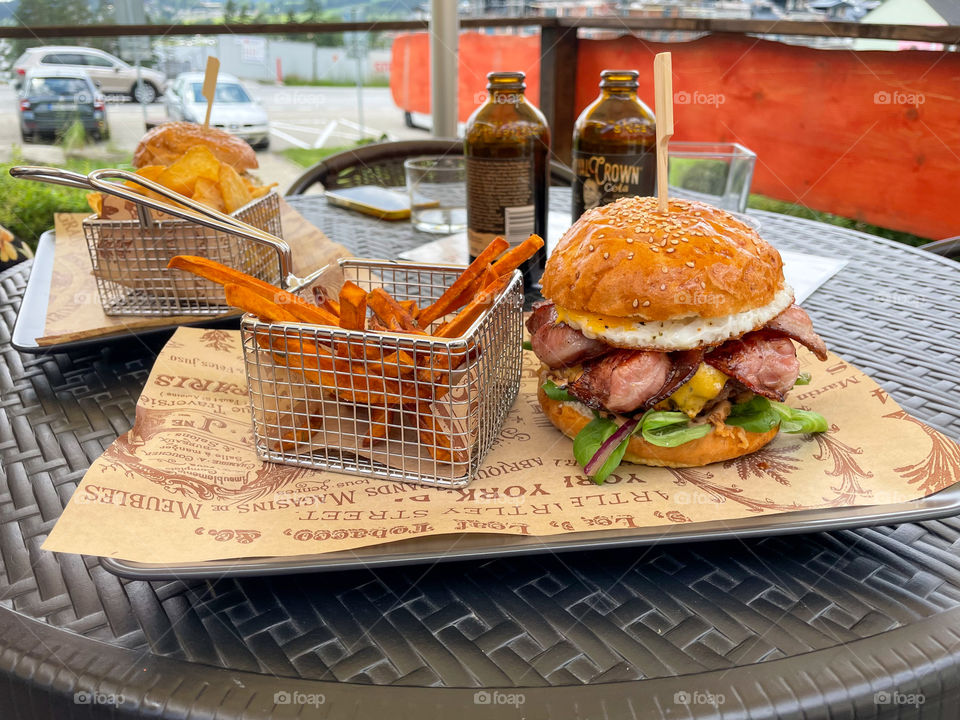 Big hamburger with Royal Crown cola and french fries.