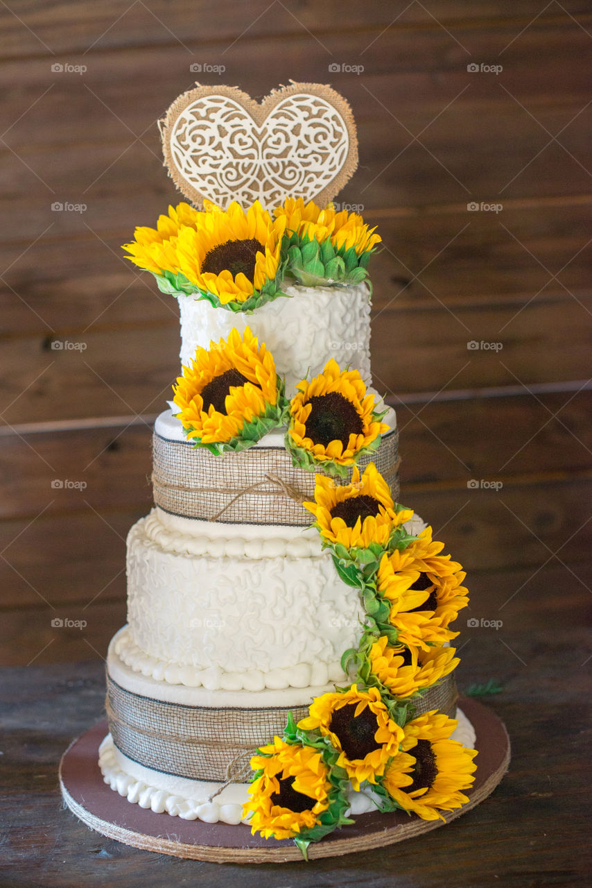 Beautiful Sunflower Lined Four tier Wedding Cake