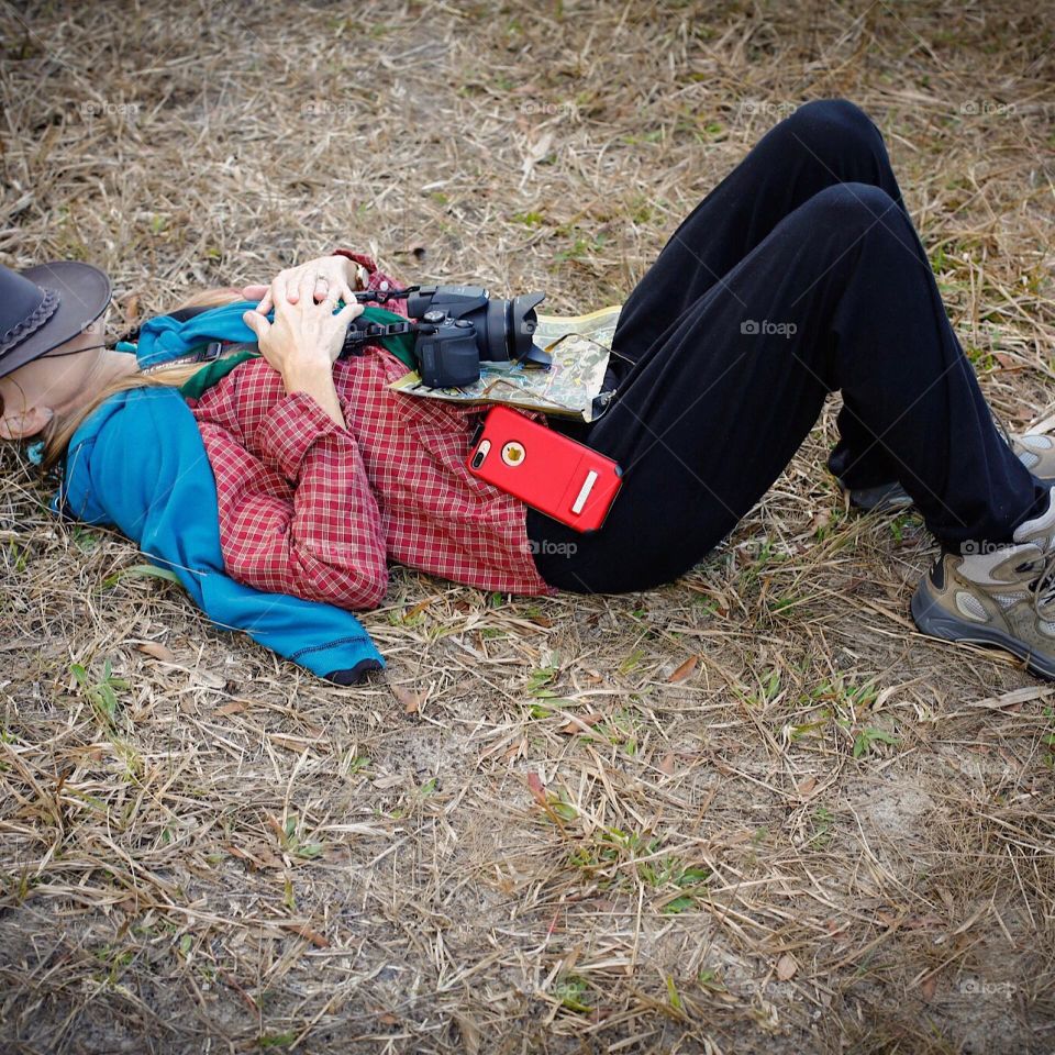 Woman resting after a vigorous hike.