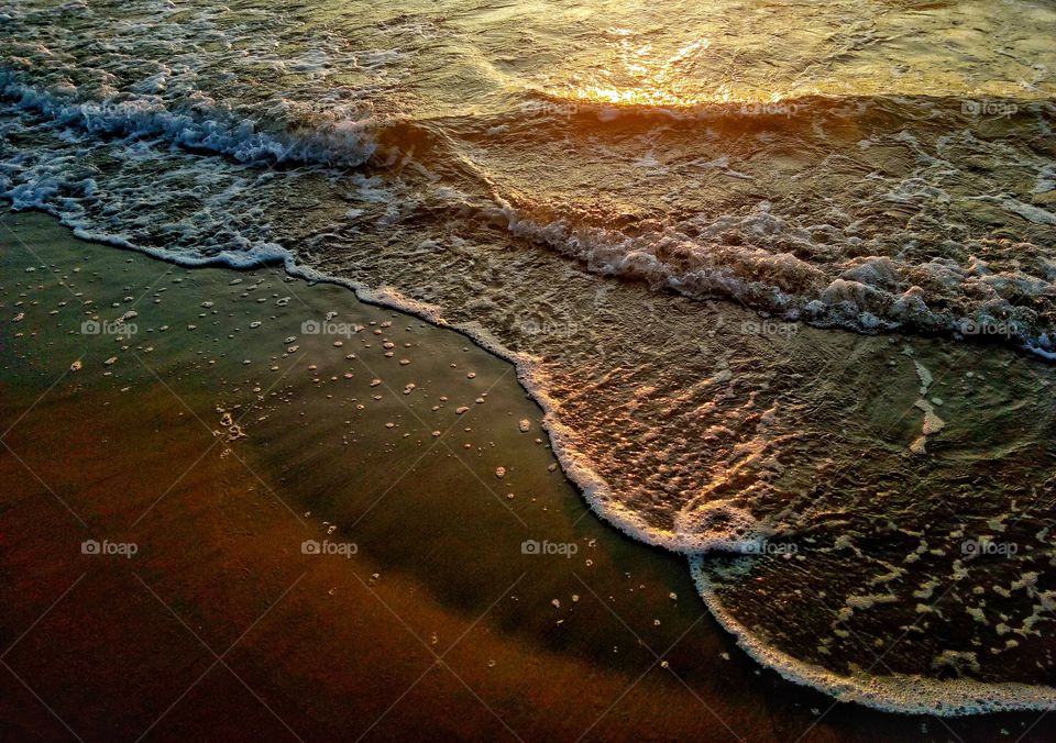 baltic sea wave view on the beach during sunrise