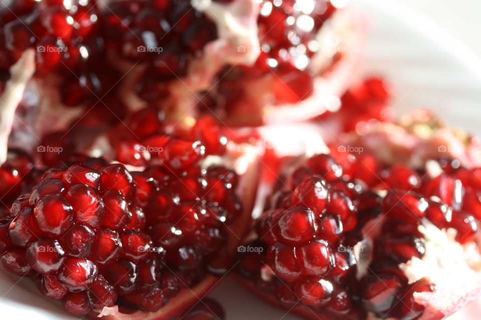 Ruby red juicy clusters of a ripe pomegranate