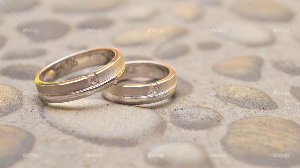 a pair of wedding rings in vintage color tone