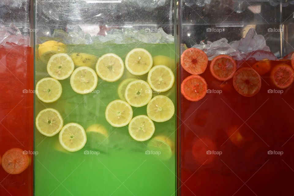 Colorful liquids in lemonade dispensers