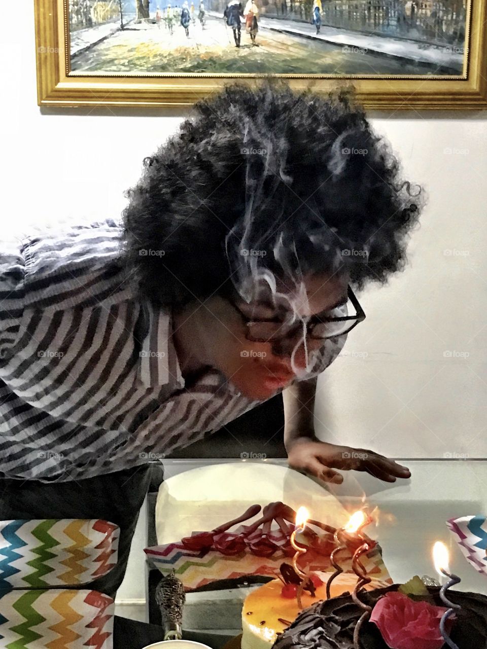 Boy blowing his birthday candles
