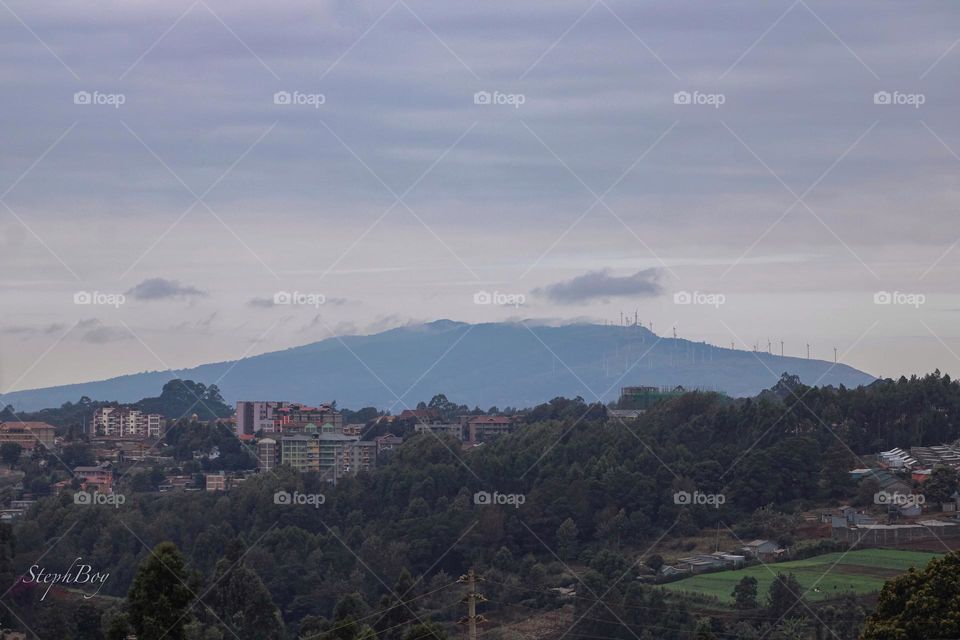 A beautiful and calming view of Ngong hills, Kenya. It combines a view of nature and the ever increasing high rises in Nairobi and it’s environs.